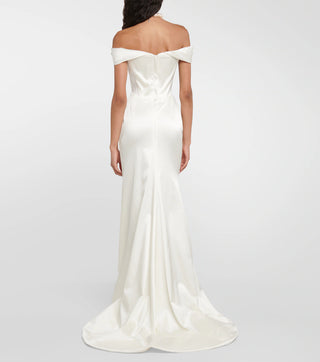Back view of the Nova Cora gown with its dramatic asymmetrical train and cinched waist.