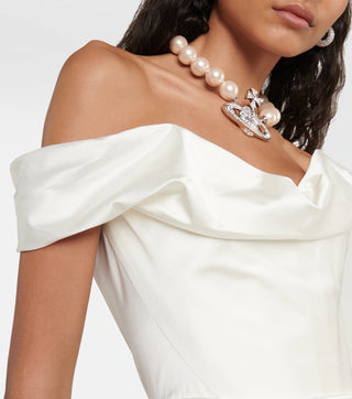 Zoomed-in view of the cinched waist on the Nova Cora gown, emphasizing the elegant silhouette and luxurious fabric.