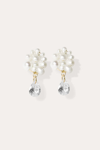 Layered freshwater pearls with radiant zirconia drops, showcasing luxurious craftsmanship and modern elegance