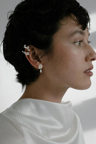 Sculptural design featuring clusters of freshwater pearls and pear-cut zirconia drops in gold vermeil