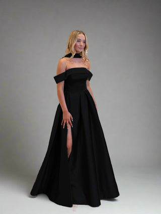 Refined formal gown with a strapless bodice and opulent taffeta skirt, exuding elegance for any grand occasion.