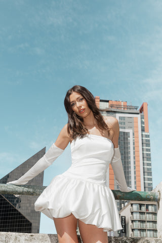 Refined satin formalwear mini with elegant strapless cut and flared bubble hemline