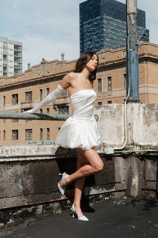 Sleek strapless formal mini with tailored fit and flared skirt, ideal for luxury bridal party looks