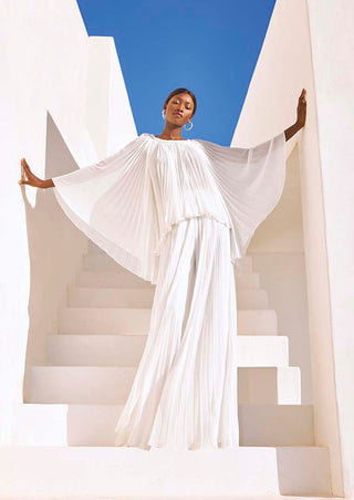 Model wearing Seema Top by Pronovias with pleated georgette fabric and batwing sleeves