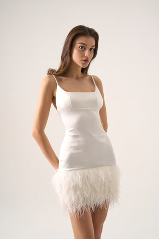 Mini bridal sheath dress with square neckline, spaghetti straps, and a feathered hem for a modern and elegant look.