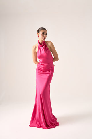 Sleek column evening gown with halter neckline and daring low back