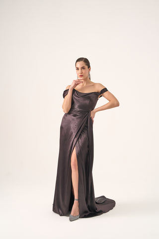 Elegant maxi evening dress showcasing a thigh-high slit, off-shoulder sleeves, and a softly draped satin bodice for timeless glamour.