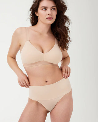 Front view of the Undie-tectable® Thong by Spanx, highlighting the smoothing waistband designed for comfort and compression.