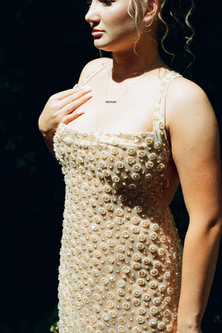 Sequin floral halter gown with sleek column silhouette and floor-length hem for evening elegance