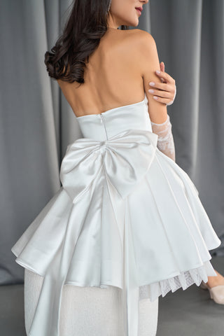 Stylish A-line bridal dress with a sweetheart neckline and whimsical layered skirt for a romantic finish.