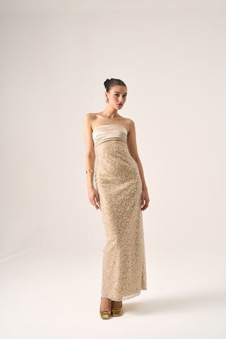 Full-body shot of the model standing in the Cristos beaded column gown, highlighting its luxurious design and sophistication.