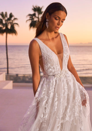 Lightweight bridal dress with organza layers and flowing A-line skirt.
