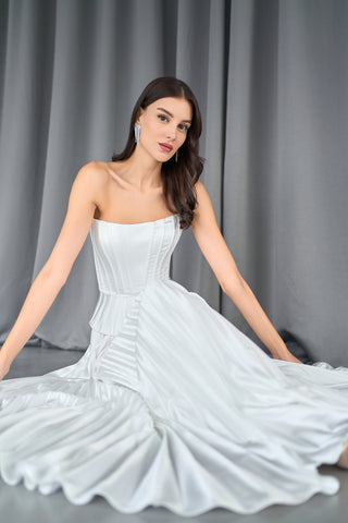 Elegant strapless bridal bustier with structured boning and a flattering peplum detail.