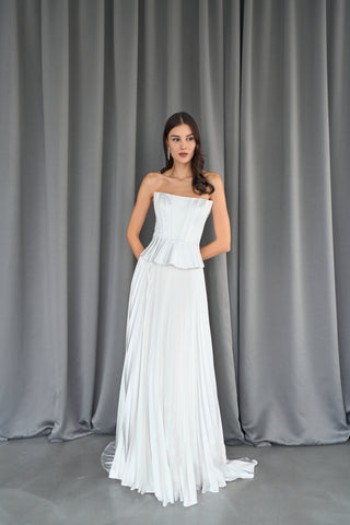Bridal bustier with modern peplum design and a smooth, form-fitting bodice for elegance.