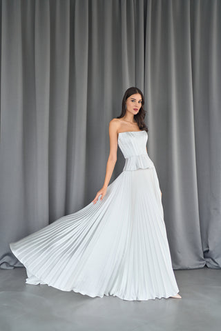 Tailored strapless bodice with delicate peplum accent, perfect for a modern bridal look.