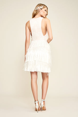 Ivory mini bridal dress with fitted bodice and playful fringe.