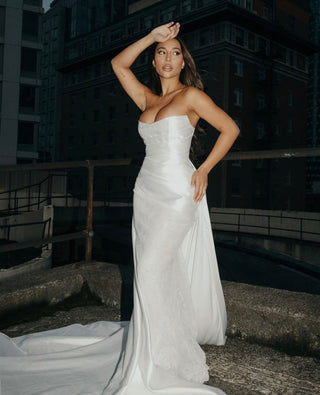 Formal top in mikado fabric, showcasing impeccable tailoring and a cascading silhouette.