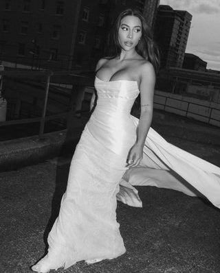 Strapless mikado top with a fitted corseted bodice for grand occasions.