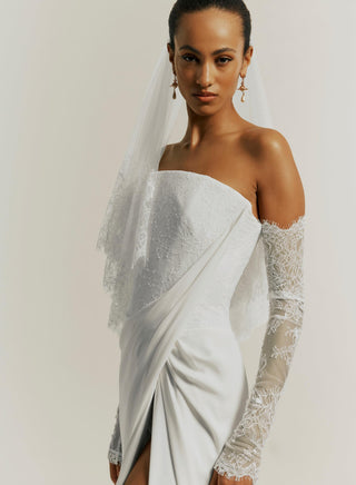 Vivienne Westwood couture lace sleeves featuring artisanal floral patterns, crafted from eco-delicate lace with bespoke British design.