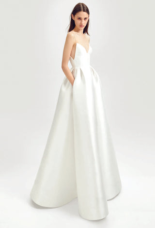 Model wearing the silk Maddison gown by Alex Perry, featuring thin straps and a full skirt.