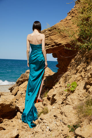 Formal strapless gown with corset-inspired bodice, ruched detailing, and thigh-high slit, perfect for black-tie events and galas