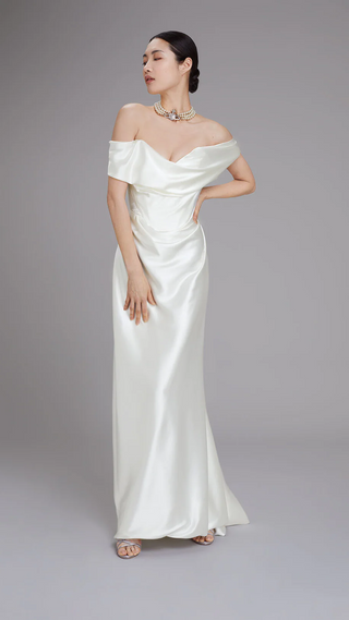 Vivienne Westwood luxury bridal gown featuring off-shoulder Bardot neckline, iconic draping, and exclusive made-to-order craftsmanship.
