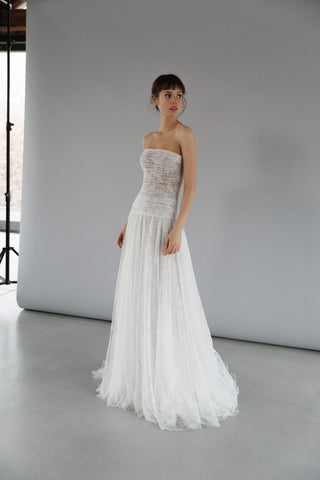 Daalarna artisanal wedding dress with corset-style structure and flowy couture lace skirt