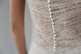 Daalarna couture lace gown showcasing bespoke hand ruching and exclusive made-to-order design