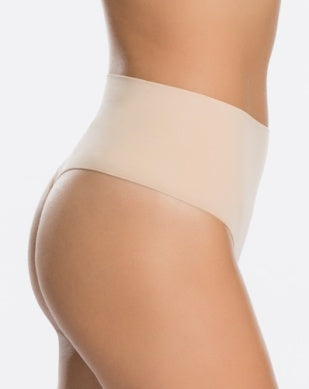 Side view of the Everyday Shaping Panties Thong by Spanx, showcasing the minimal stitching and breathable fabric that ensure invisibility under clothing.