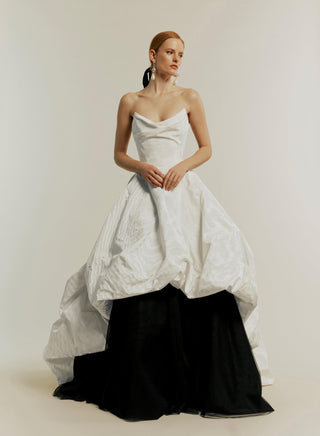 Styled with the Joe Petticoat under the black Victoria gown, highlighting the gown’s intricate diamond pattern-cutting technique and creating a dramatic silhouette.