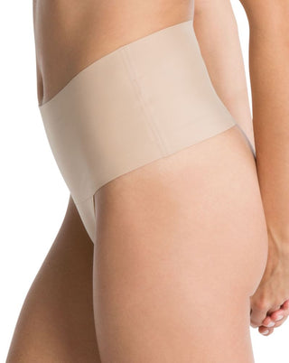 Undie-tectable® Thong by Spanx, side view demonstrating the thin, elastic-free edges for a discreet fit.