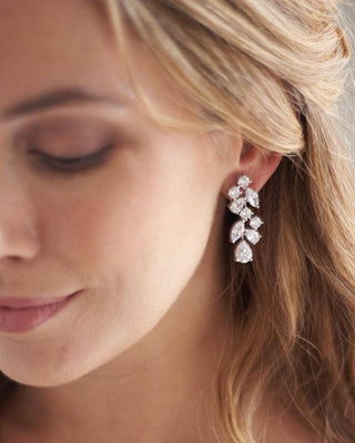 Close-up of a woman wearing a diamond earring with a blurred background