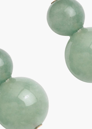 Elegant designer jewelry showcasing polished beadwork and a clean, symmetrical drop design
