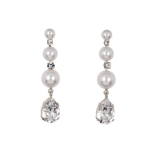 Pair of pearl and crystal drop earrings on a white background