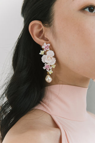 Luxury floral earrings with layered polymer petals and a baroque pearl drop, designed for sophisticated evening wear.