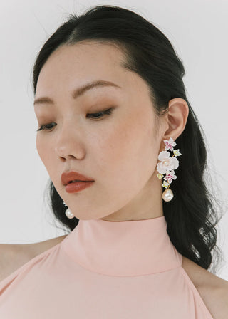 Exquisite designer earrings featuring delicate hand-pressed petals and luminous pearl accents, perfect for high-fashion moments.