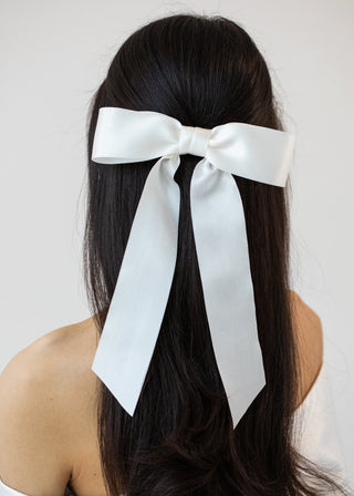 Close-up of Virginia Bow Barrette in Snow on model – detailed view of silk satin texture and bow design