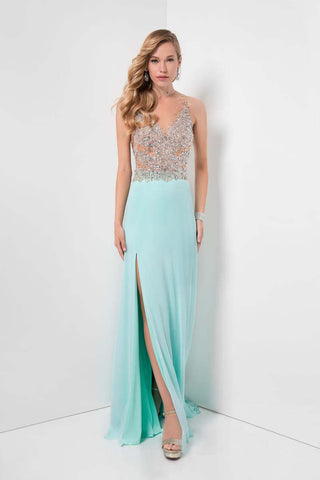 Woman wearing a light blue evening gown with a slit and beaded top against a white background
