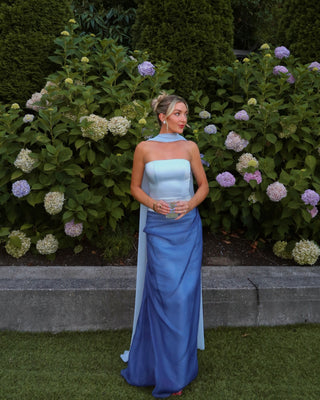 Sophisticated maxi evening dress featuring sleek strapless bodice and graceful cape accent for timeless formal style