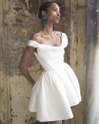 Slight off-side view of the Mini Bagatelle gown by Vivienne Westwood, emphasizing the elegant lines and romantic draping of the dress.