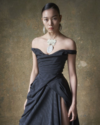 Detailed three-quarter view of the black Tabitha gown, focusing on the Baroque-inspired design.