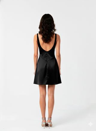 Woman wearing a black dress with a white background