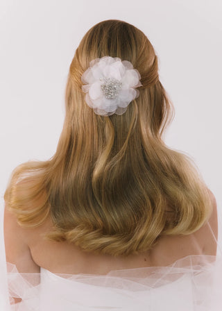 Luxurious handcrafted headpiece with dimensional organza petals and couture-inspired embellishments