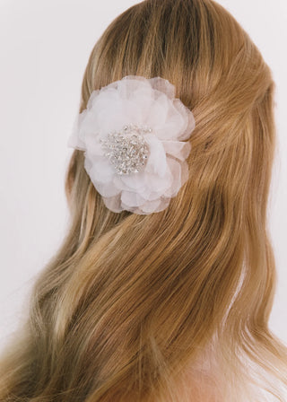 Formal floral headpiece with layered silk textures and high-impact silhouette for luxury evening wear