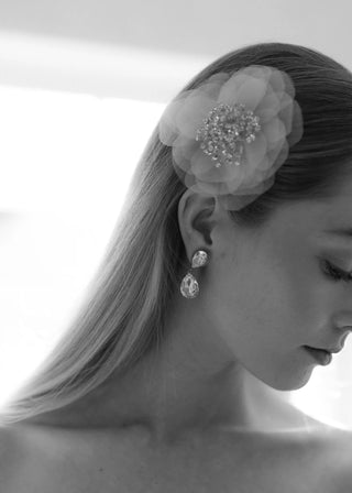 Statement bridal hair accessory with crystal-studded stamen and couture-grade silk craftsmanship