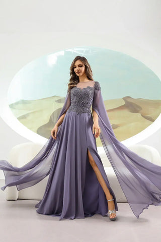 Woman wearing a long, elegant purple dress with a scenic background