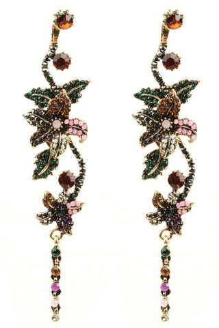 Decorative earrings with gemstones on a white background