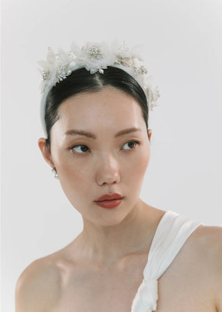 Graceful headband with sculpted silk blooms and crystal highlights, evoking vintage millinery artistry