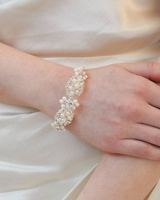 Pearl bracelet on a wrist with a soft background
