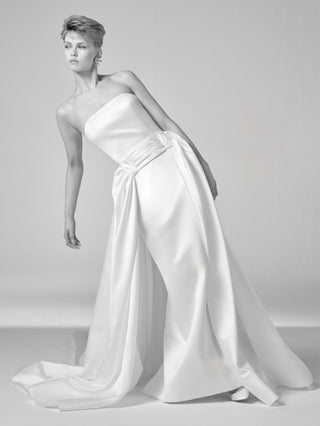 Viktor&Rolf couture satin bridal gown with strapless column silhouette, bespoke draping, and artisanal craftsmanship for luxury brides